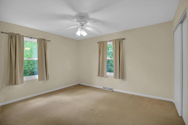 309 E Mchenry St, Urbana, IL 61801 - unfurnished bedroom with carpet flooring, a closet, and ceiling fan
