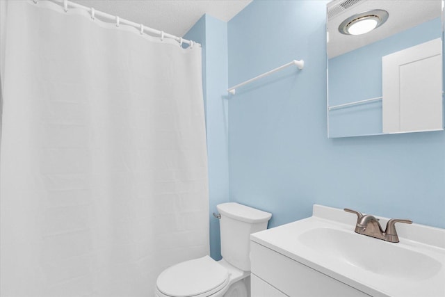 309 E Mchenry St, Urbana, IL 61801 - bathroom with a textured ceiling, vanity, and a shower with shower curtain