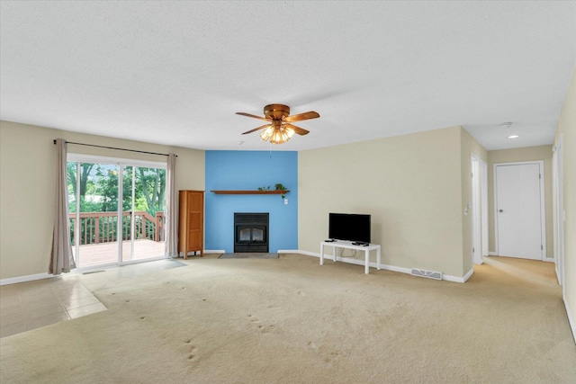 309 E Mchenry St, Urbana, IL 61801 - unfurnished living room with a fireplace, ceiling fan, carpet flooring, and recessed lighting