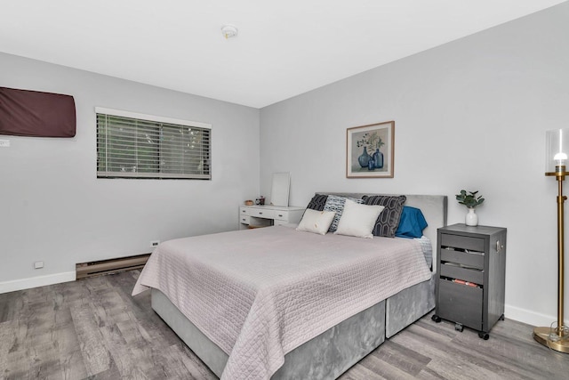 1118 Cedar St Unit 1B, Glendale Heights, IL 60139 - bedroom with wood finished floors, baseboards, and baseboard heating