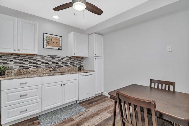 1118 Cedar St Unit 1B, Glendale Heights, IL 60139 - kitchen with white dishwasher, a sink, wood finished floors, tasteful backsplash, and ceiling fan