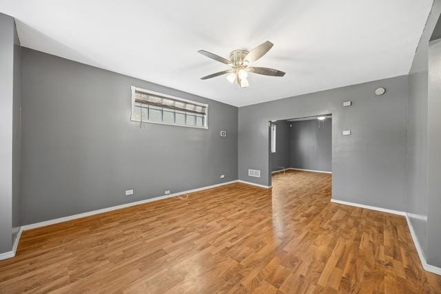 6812 S Lafayette Ave, Chicago, IL 60621 - spare room featuring ceiling fan and wood finished floors
