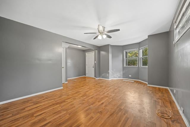 6812 S Lafayette Ave, Chicago, IL 60621 - unfurnished room with a ceiling fan and wood finished floors