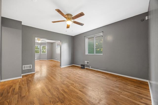 6812 S Lafayette Ave, Chicago, IL 60621 - empty room featuring ceiling fan and wood finished floors
