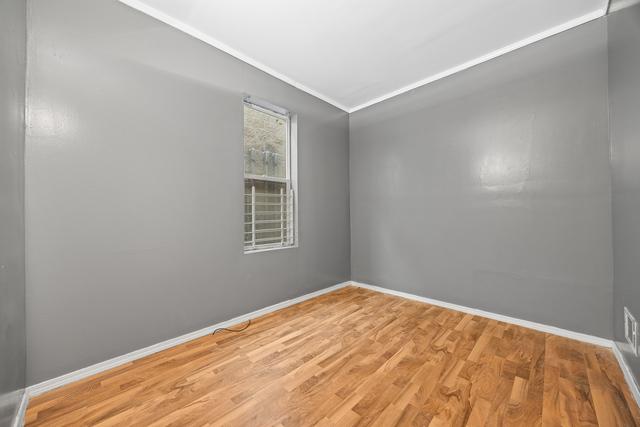 6812 S Lafayette Ave, Chicago, IL 60621 - unfurnished room with wood finished floors and ornamental molding