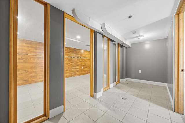 6812 S Lafayette Ave, Chicago, IL 60621 - corridor with wooden walls and light tile patterned flooring