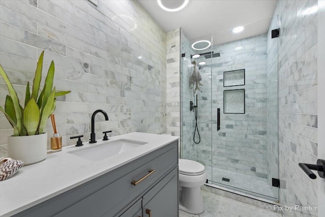 2800 Northampton Dr Unit A2, Rolling Meadows, IL 60008 - bathroom with vanity, toilet, a shower stall, tile patterned floors, and tile walls