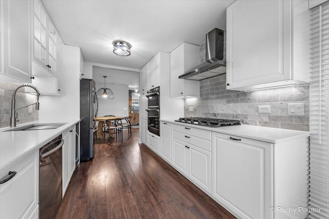 2800 Northampton Dr Unit A2, Rolling Meadows, IL 60008 - kitchen featuring wall chimney exhaust hood, appliances with stainless steel finishes, a sink, dark wood-style floors, and backsplash