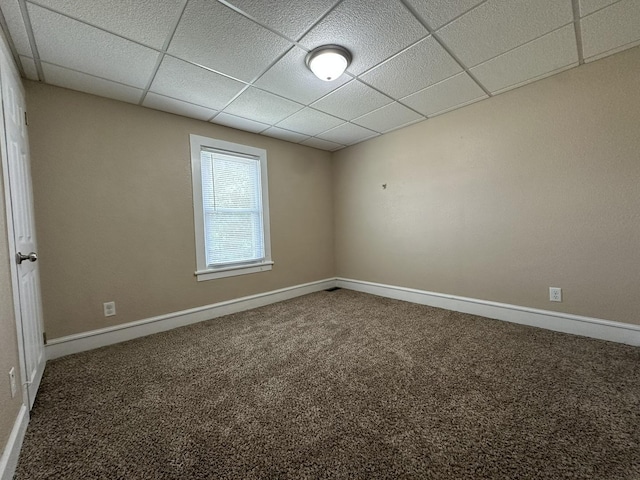 1109 S Locust Ave, Freeport, IL 61032 - carpeted empty room featuring baseboards and a drop ceiling