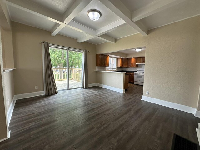 1109 S Locust Ave, Freeport, IL 61032 - unfurnished living room with coffered ceiling, dark wood-style floors, beamed ceiling, and baseboards