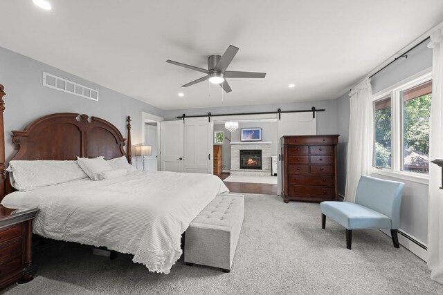 5760 Woodward Ave, Downers Grove, IL 60516 - carpeted bedroom with a barn door, baseboard heating, recessed lighting, and ceiling fan