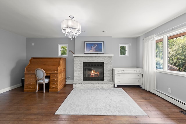 5760 Woodward Ave, Downers Grove, IL 60516 - unfurnished living room with dark wood-style floors, a fireplace, a baseboard radiator, and a chandelier