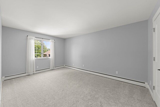 5760 Woodward Ave, Downers Grove, IL 60516 - carpeted empty room featuring a baseboard heating unit and baseboards