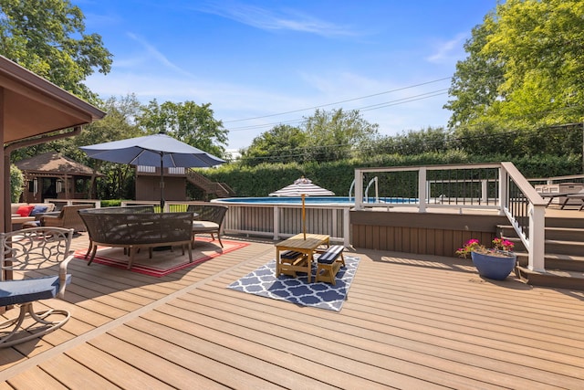 5760 Woodward Ave, Downers Grove, IL 60516 - deck with outdoor dining space, an outdoor pool, and stairs