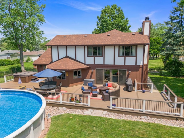5760 Woodward Ave, Downers Grove, IL 60516 - back of house with roof with shingles, a chimney, a wooden deck, a jacuzzi, and outdoor lounge area