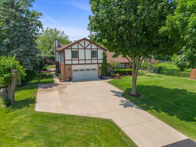 5760 Woodward Ave, Downers Grove, IL 60516 - tudor home featuring an attached garage, driveway, a chimney, stucco siding, and brick siding