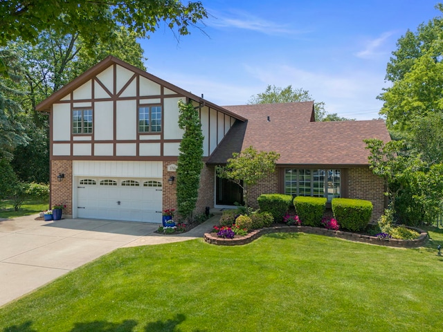 5760 Woodward Ave, Downers Grove, IL 60516 - tudor-style house with concrete driveway, brick siding, a garage, and a front yard
