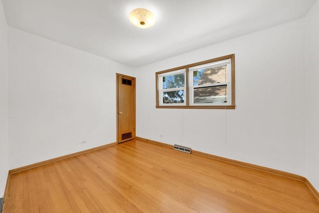 5438 S Hamlin Ave, Chicago, IL 60632 - spare room with light wood-style floors and baseboards