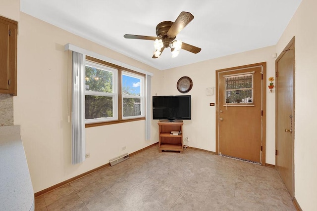 5438 S Hamlin Ave, Chicago, IL 60632 - unfurnished living room with ceiling fan and baseboards