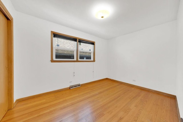 5438 S Hamlin Ave, Chicago, IL 60632 - empty room featuring light wood finished floors and baseboards