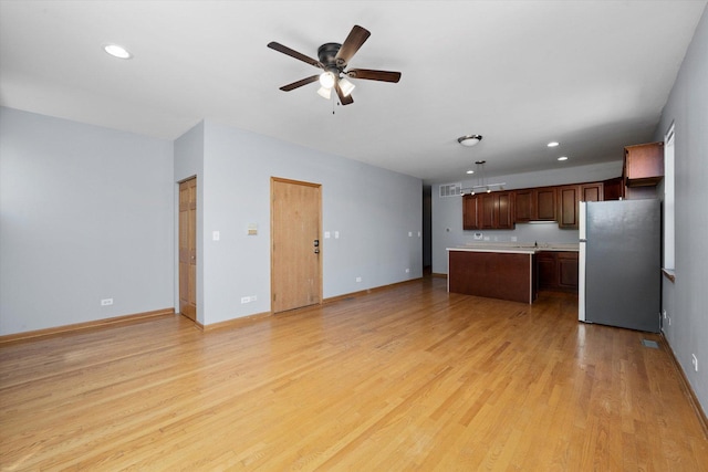 6528 S University Ave Unit 3N, Chicago, IL 60615 - kitchen featuring freestanding refrigerator, open floor plan, light countertops, ceiling fan, and light wood-style floors
