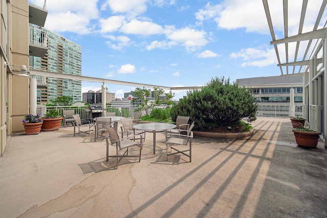 1640 Maple Ave Unit 1105, Evanston, IL 60201 - view of patio featuring a view of city, outdoor dining space, and grilling area