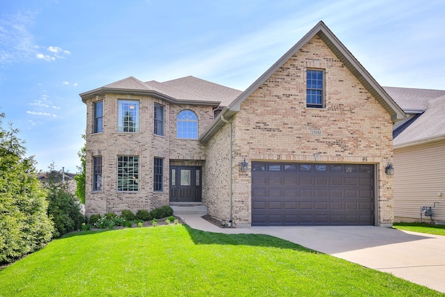 1N183 Stacy Ct, Glen Ellyn, IL 60137 - view of front of property with brick siding, a front lawn, driveway, and an attached garage