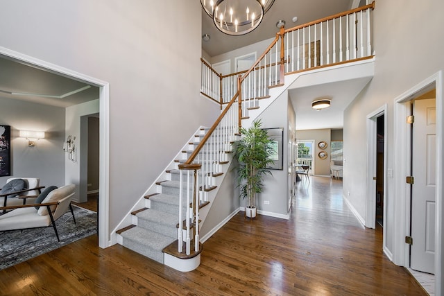 1N183 Stacy Ct, Glen Ellyn, IL 60137 - stairway with wood finished floors, a towering ceiling, and a chandelier