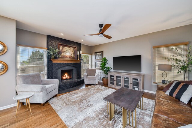 1N183 Stacy Ct, Glen Ellyn, IL 60137 - living room with a fireplace, plenty of natural light, a ceiling fan, wood finished floors, and recessed lighting