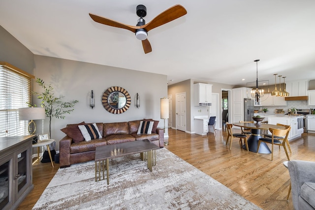 1N183 Stacy Ct, Glen Ellyn, IL 60137 - living area featuring healthy amount of natural light, ceiling fan, and light wood-type flooring