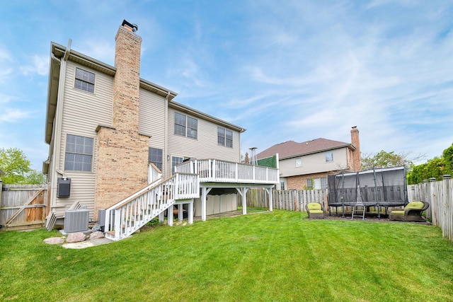 1N183 Stacy Ct, Glen Ellyn, IL 60137 - back of property featuring stairway, a fenced backyard, a deck, and a chimney