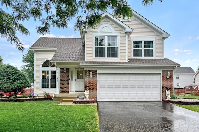 1239 Spring Creek Rd, Elgin, IL 60120 - traditional-style house with driveway, an attached garage, a front yard, and a shingled roof