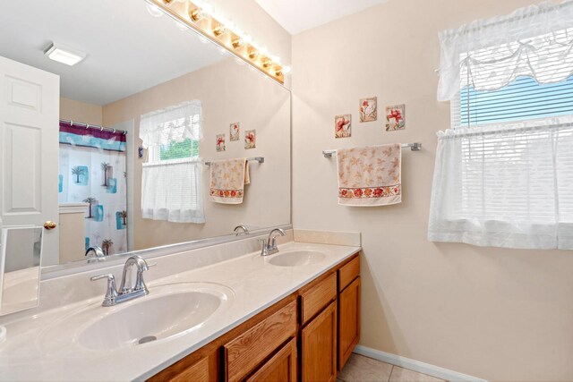 1239 Spring Creek Rd, Elgin, IL 60120 - full bathroom featuring double vanity, tile patterned floors, and curtained shower