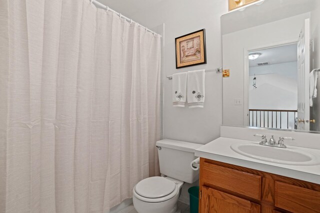 1239 Spring Creek Rd, Elgin, IL 60120 - bathroom with toilet, vanity, and curtained shower