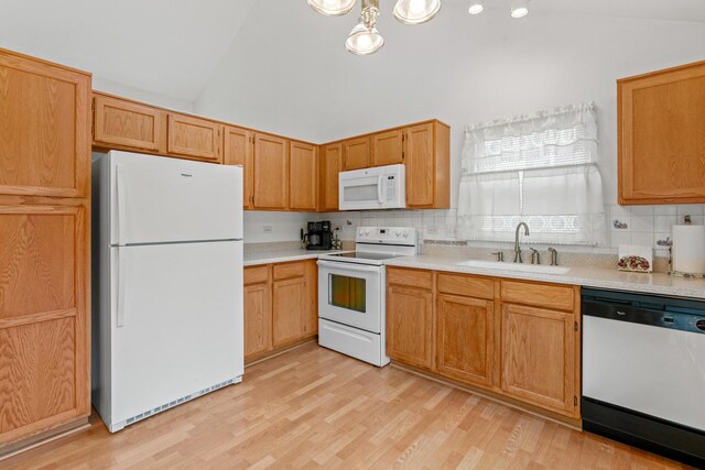 1239 Spring Creek Rd, Elgin, IL 60120 - kitchen featuring white appliances, a sink, light countertops, backsplash, and light wood-type flooring