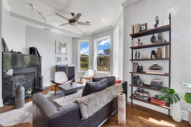 3034 W N Ave Unit 2, Chicago, IL 60647 - living room featuring ornamental molding, ceiling fan, a fireplace, wood finished floors, and rail lighting