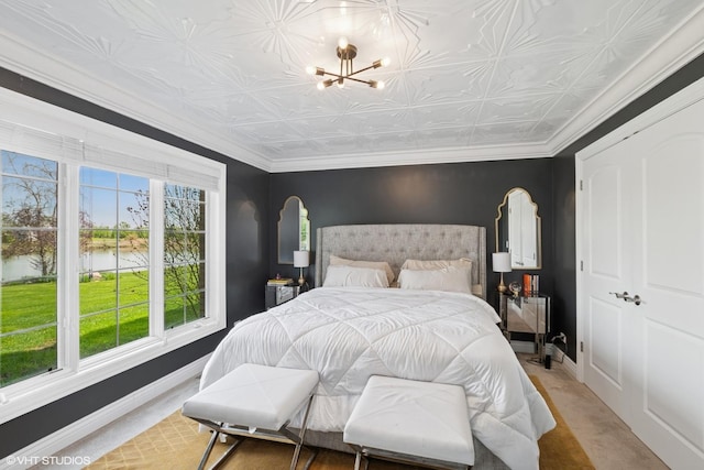 22844 Lakeview Estates Blvd, Frankfort, IL 60423 - bedroom with a water view, a chandelier, baseboards, and an ornate ceiling