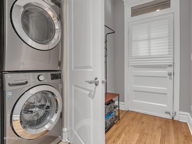 2354 W Wilson Ave Unit 1W, Chicago, IL 60625 - laundry area featuring stacked washer / drying machine and light wood finished floors