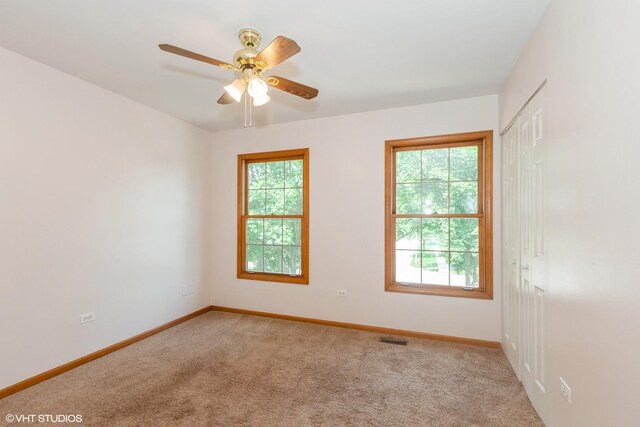 8885 Dryden St, Woodridge, IL 60517 - carpeted spare room with baseboards and a ceiling fan