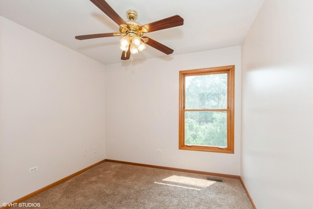 8885 Dryden St, Woodridge, IL 60517 - spare room with carpet, baseboards, and a ceiling fan