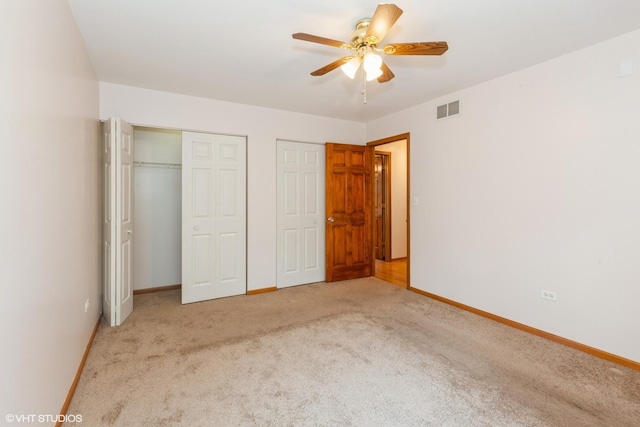 8885 Dryden St, Woodridge, IL 60517 - unfurnished bedroom featuring two closets, carpet flooring, and baseboards