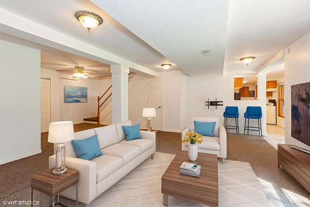 8885 Dryden St, Woodridge, IL 60517 - living room featuring washer / dryer, baseboards, stairway, and light carpet