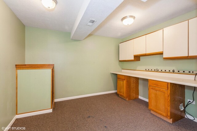 8885 Dryden St, Woodridge, IL 60517 - kitchen with carpet, baseboards, light countertops, and white cabinets