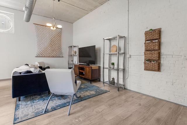 519 N Hickory St Unit 519, Champaign, IL 61820 - living room with a high ceiling, wood finished floors, and a chandelier