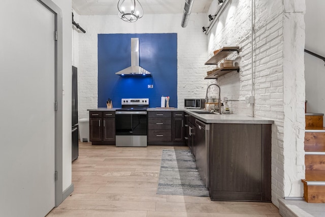 519 N Hickory St Unit 519, Champaign, IL 61820 - kitchen featuring stainless steel appliances, range hood, open shelves, a sink, and light wood-type flooring