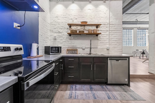 519 N Hickory St Unit 519, Champaign, IL 61820 - kitchen with electric range oven, stainless steel dishwasher, a sink, custom range hood, and light wood finished floors