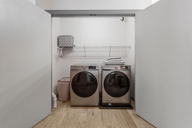 519 N Hickory St Unit 519, Champaign, IL 61820 - laundry area with separate washer and dryer and wood finished floors