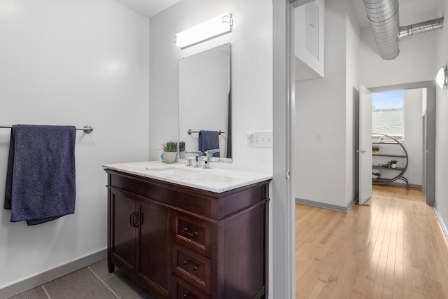 519 N Hickory St Unit 519, Champaign, IL 61820 - bathroom featuring vanity, wood finished floors, and baseboards