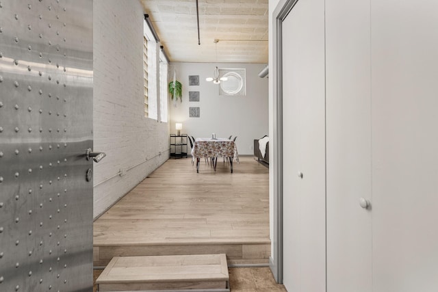 519 N Hickory St Unit 519, Champaign, IL 61820 - hall featuring light wood-style floors and a chandelier