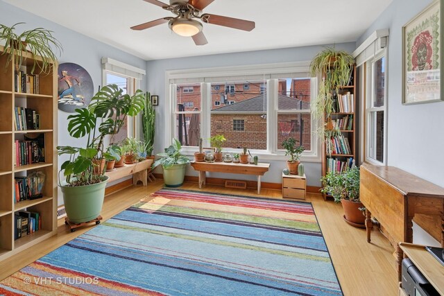 6967 W Wolfram St, Chicago, IL 60634 - living area featuring wood finished floors and ceiling fan